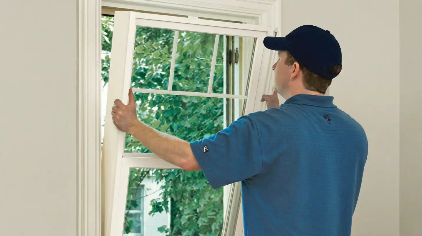 Professional contractors performing a residential window insulation and replacement service in San Jose, CA